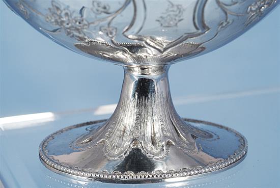 A Victorian silver swing handled sugar basket and sifter spoon, by Martin, Hall & Co, basket height 190mm, weight 7.7oz/241grms.